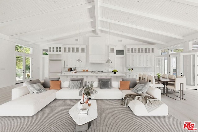 living room with beam ceiling, high vaulted ceiling, light hardwood / wood-style flooring, and french doors