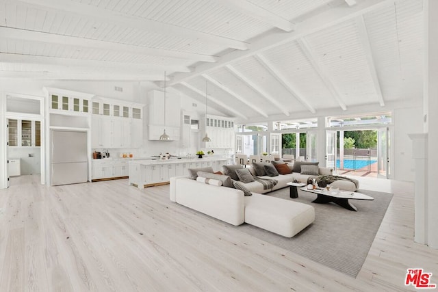 living room with beam ceiling, light hardwood / wood-style flooring, and high vaulted ceiling