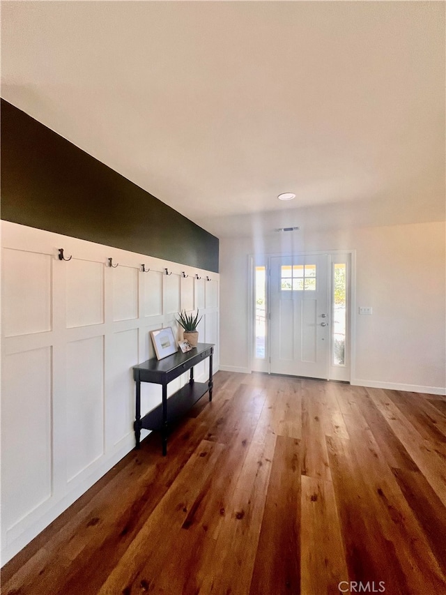 entrance foyer featuring hardwood / wood-style floors