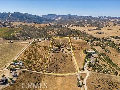 aerial view featuring a mountain view and a rural view