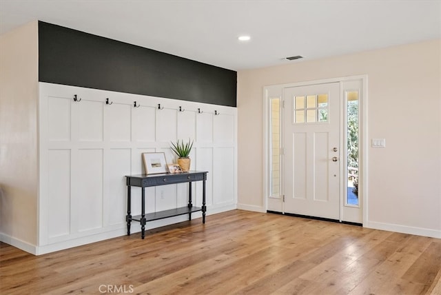 entryway with light hardwood / wood-style flooring