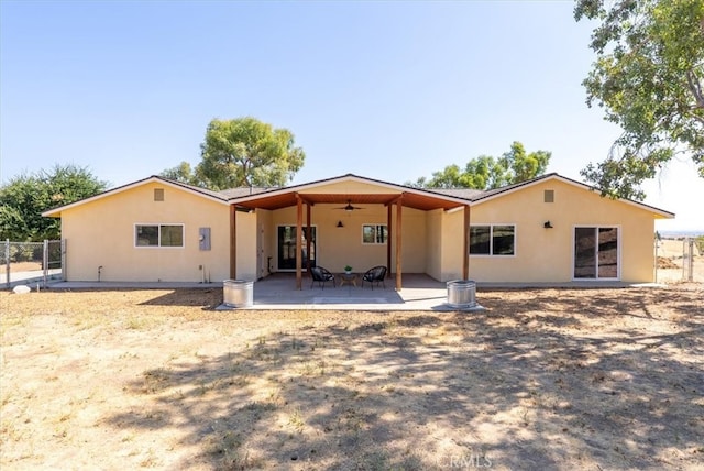 back of property featuring a patio area and ceiling fan