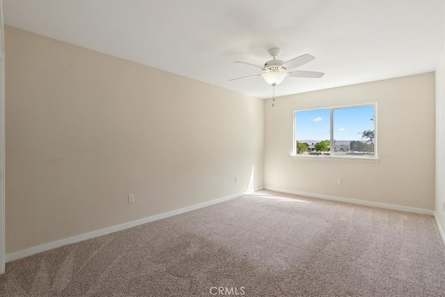 unfurnished room featuring carpet floors and ceiling fan