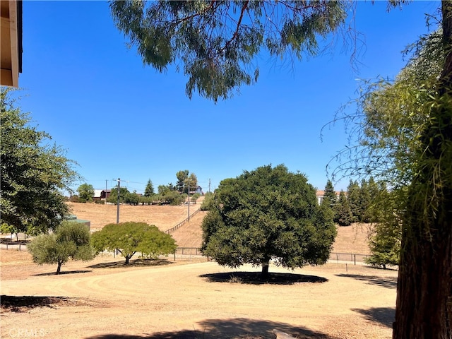 view of yard with a rural view