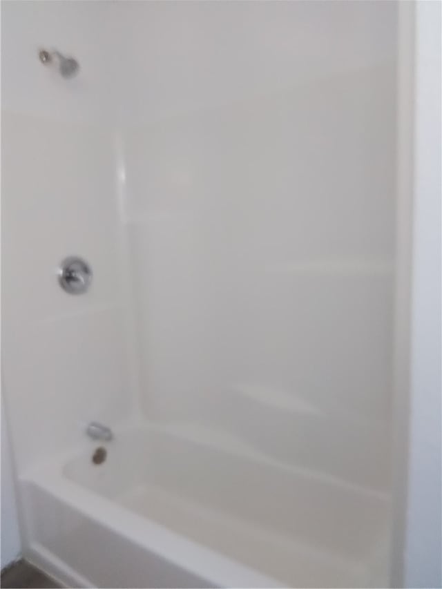 bathroom featuring washtub / shower combination