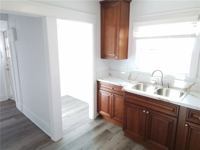 kitchen with light hardwood / wood-style floors and sink