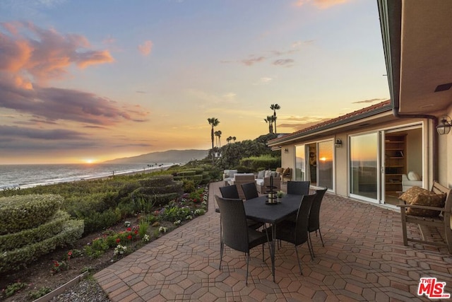 patio terrace at dusk with a water view