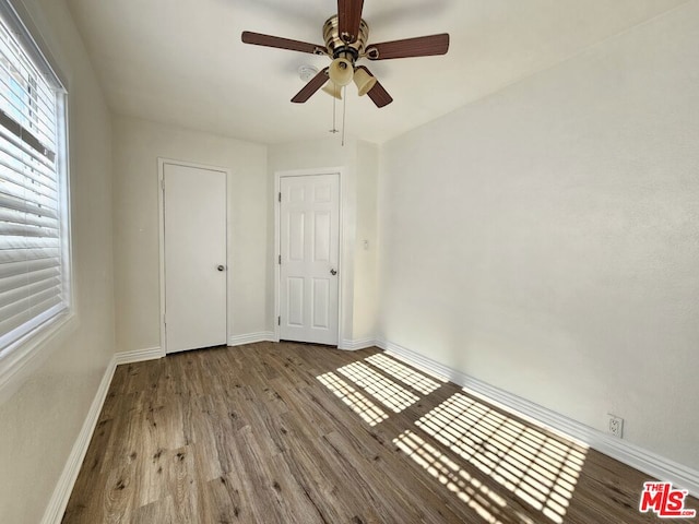 unfurnished bedroom featuring ceiling fan and light hardwood / wood-style flooring