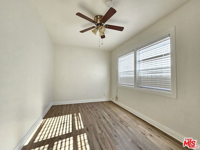 unfurnished room with ceiling fan and light wood-type flooring