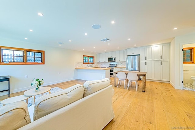 living room with light hardwood / wood-style floors