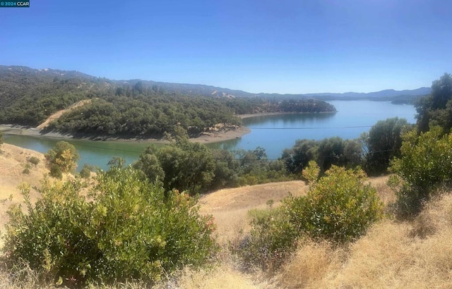 property view of water featuring a mountain view