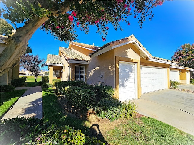 mediterranean / spanish-style home featuring a garage