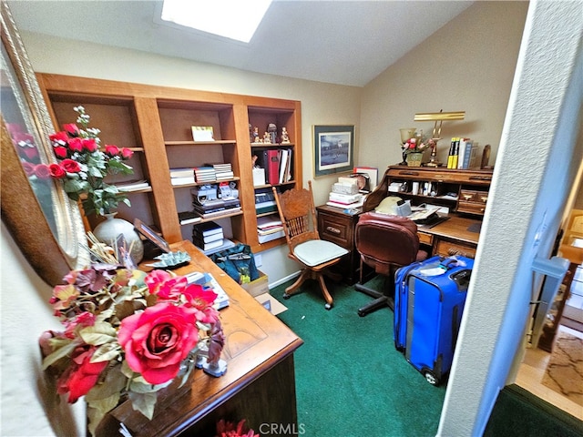 carpeted office with vaulted ceiling