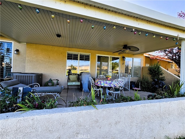 view of patio featuring ceiling fan and cooling unit