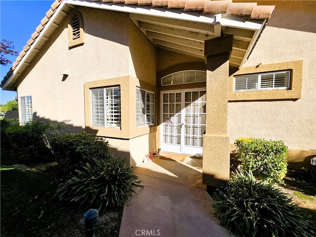 entrance to property featuring french doors