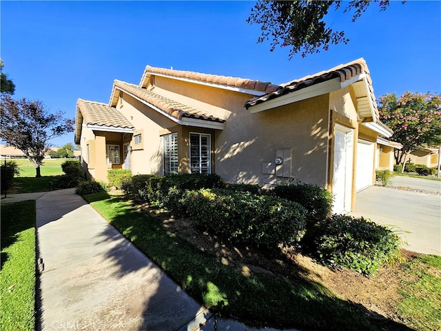 view of side of property featuring a garage