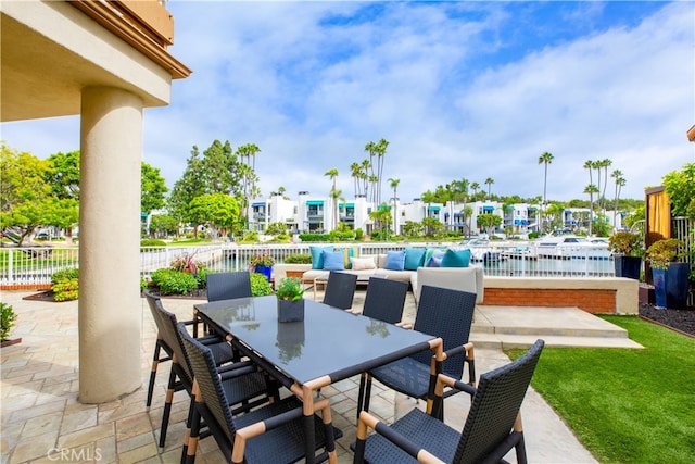 view of patio with a water view