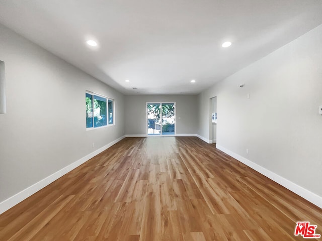 spare room with light hardwood / wood-style floors