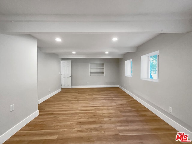 basement featuring hardwood / wood-style flooring