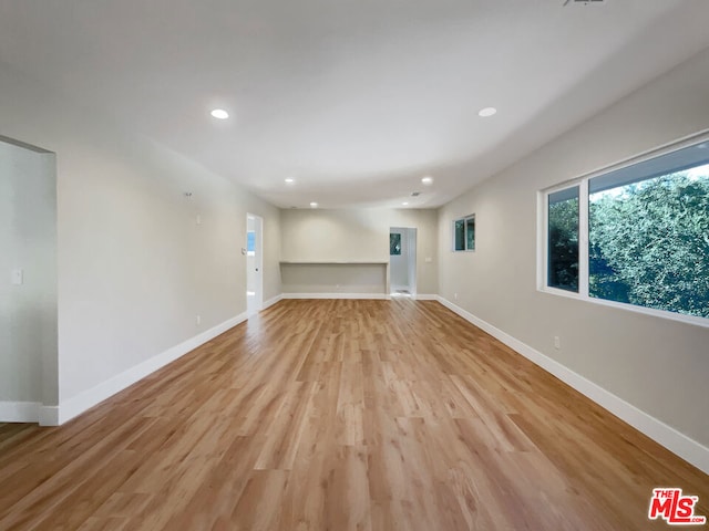 unfurnished living room featuring light hardwood / wood-style flooring