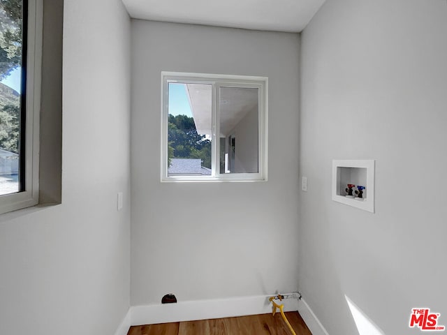 laundry room with hookup for a washing machine and hardwood / wood-style flooring