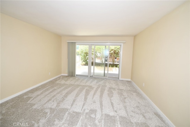 spare room with light colored carpet