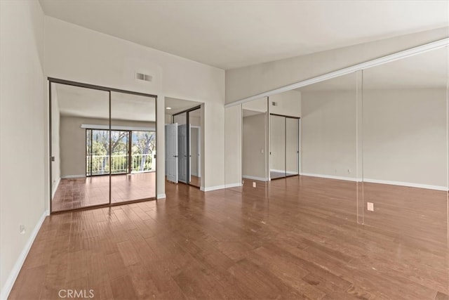 unfurnished room featuring wood-type flooring