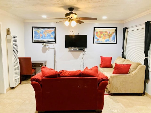 tiled living room featuring ceiling fan, heating unit, ornamental molding, and a textured ceiling