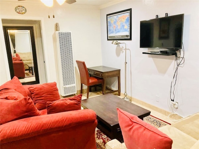 living room featuring ornamental molding and ceiling fan