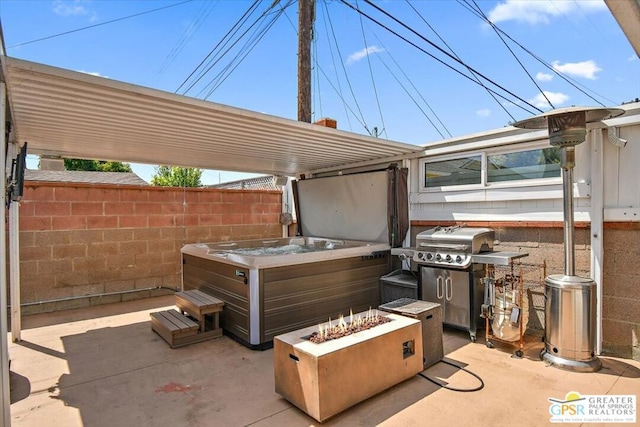 view of patio featuring a fire pit and a grill