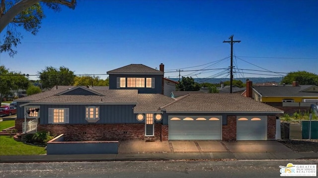 view of front of home with a garage