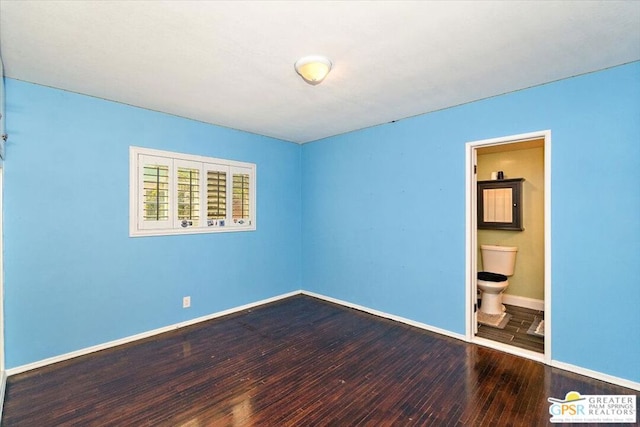 empty room with hardwood / wood-style flooring