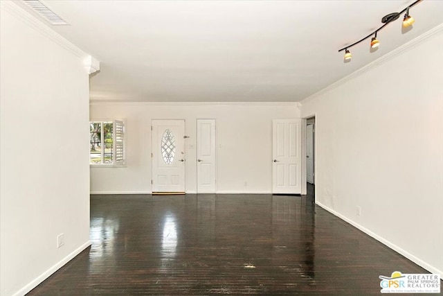 entryway with rail lighting, crown molding, and dark hardwood / wood-style flooring