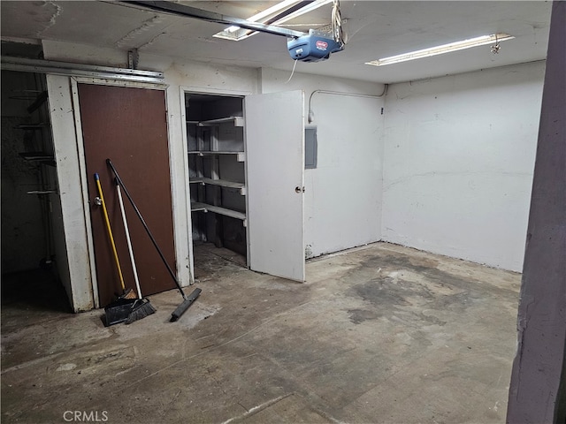 garage featuring a garage door opener and electric panel