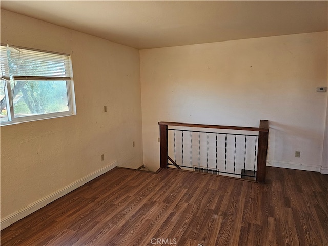 empty room featuring dark hardwood / wood-style floors