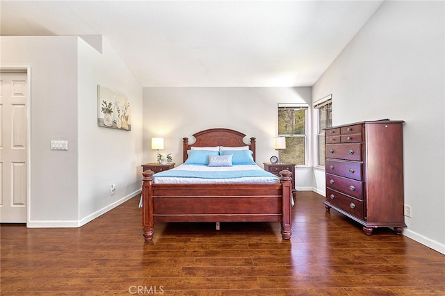 bedroom with dark wood-type flooring