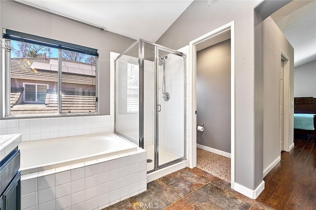 bathroom with vanity, plus walk in shower, and hardwood / wood-style flooring