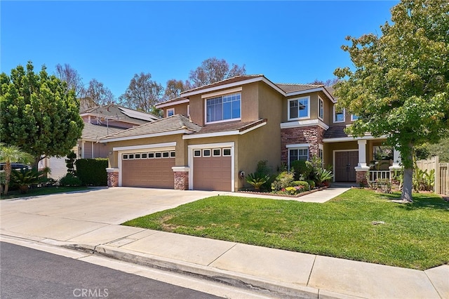 view of front of property featuring a front yard and a garage