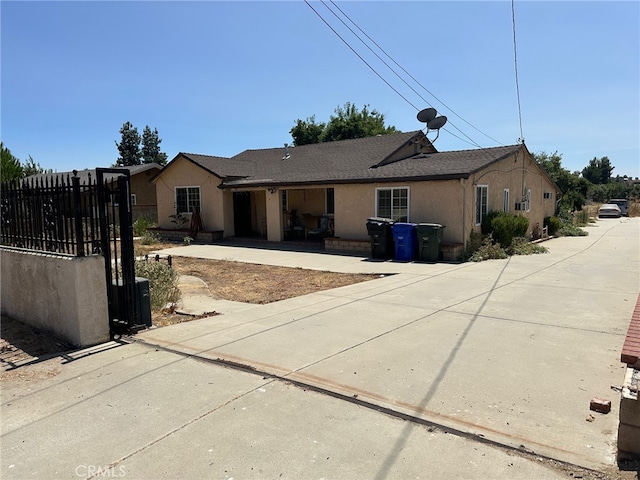 ranch-style home with a patio