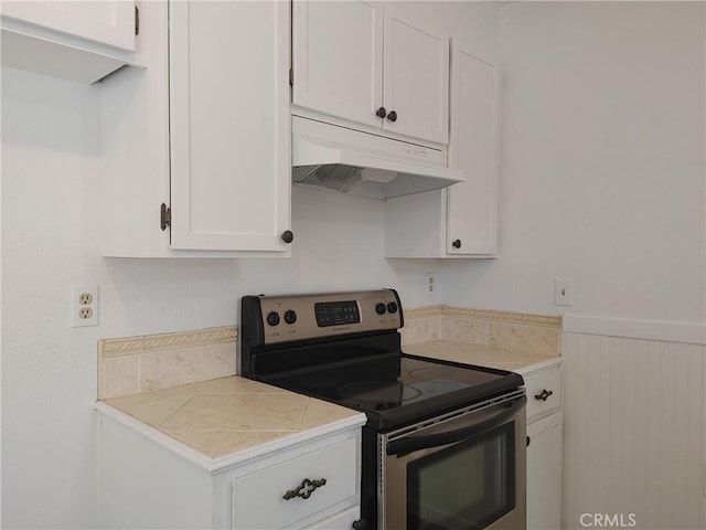 kitchen with white cabinets and stainless steel electric range oven