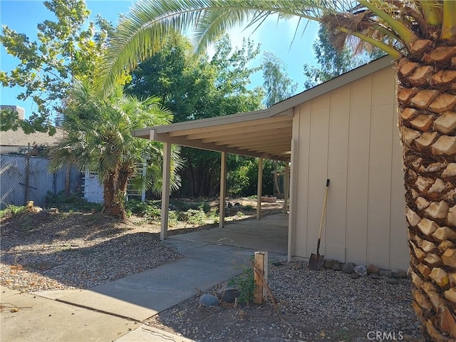 view of parking / parking lot featuring a carport