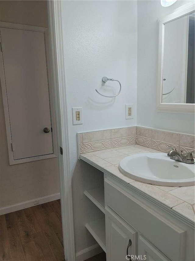 bathroom featuring vanity and wood-type flooring