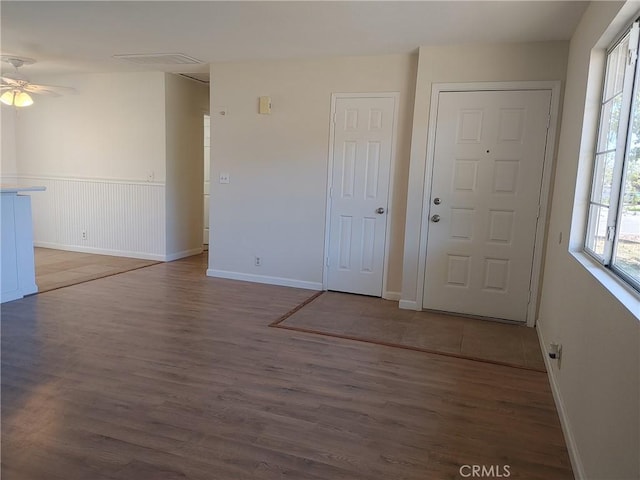 foyer entrance featuring hardwood / wood-style floors, plenty of natural light, and ceiling fan