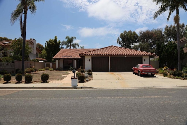 mediterranean / spanish-style home featuring a garage