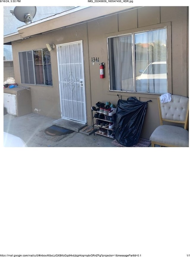 doorway to property featuring a patio