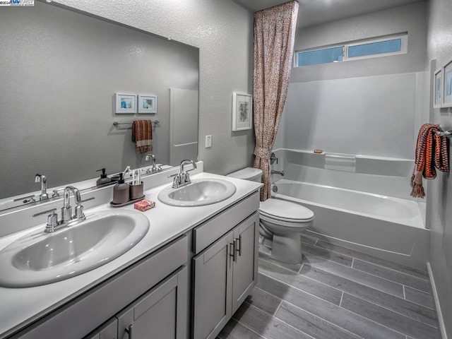 full bathroom with shower / bathing tub combination, vanity, and toilet