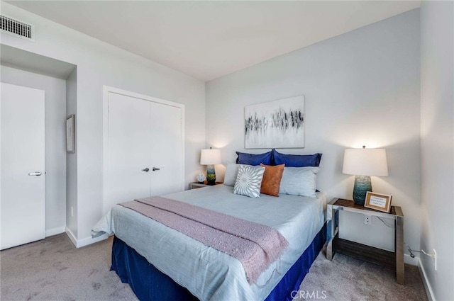 carpeted bedroom with a closet