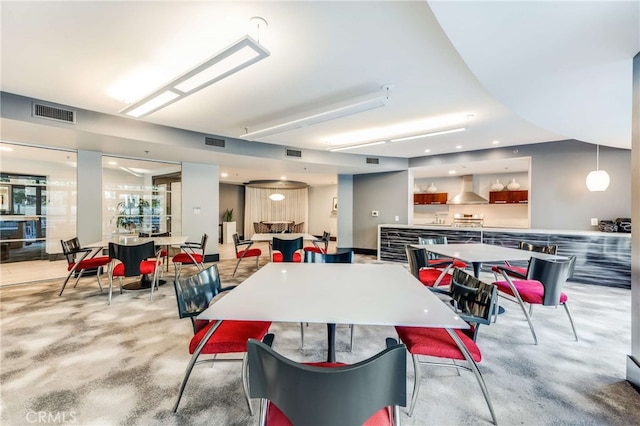 dining area with light colored carpet