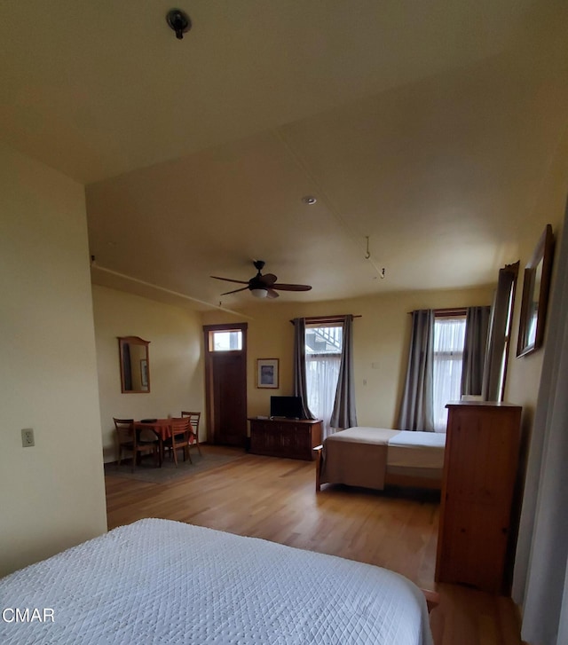 bedroom with light hardwood / wood-style flooring and ceiling fan