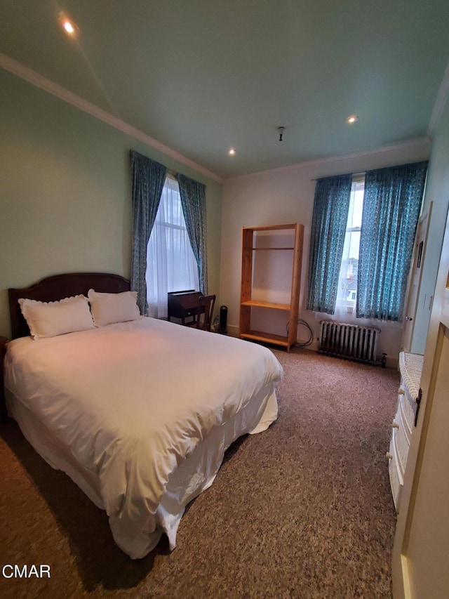 bedroom with crown molding, carpet, and radiator